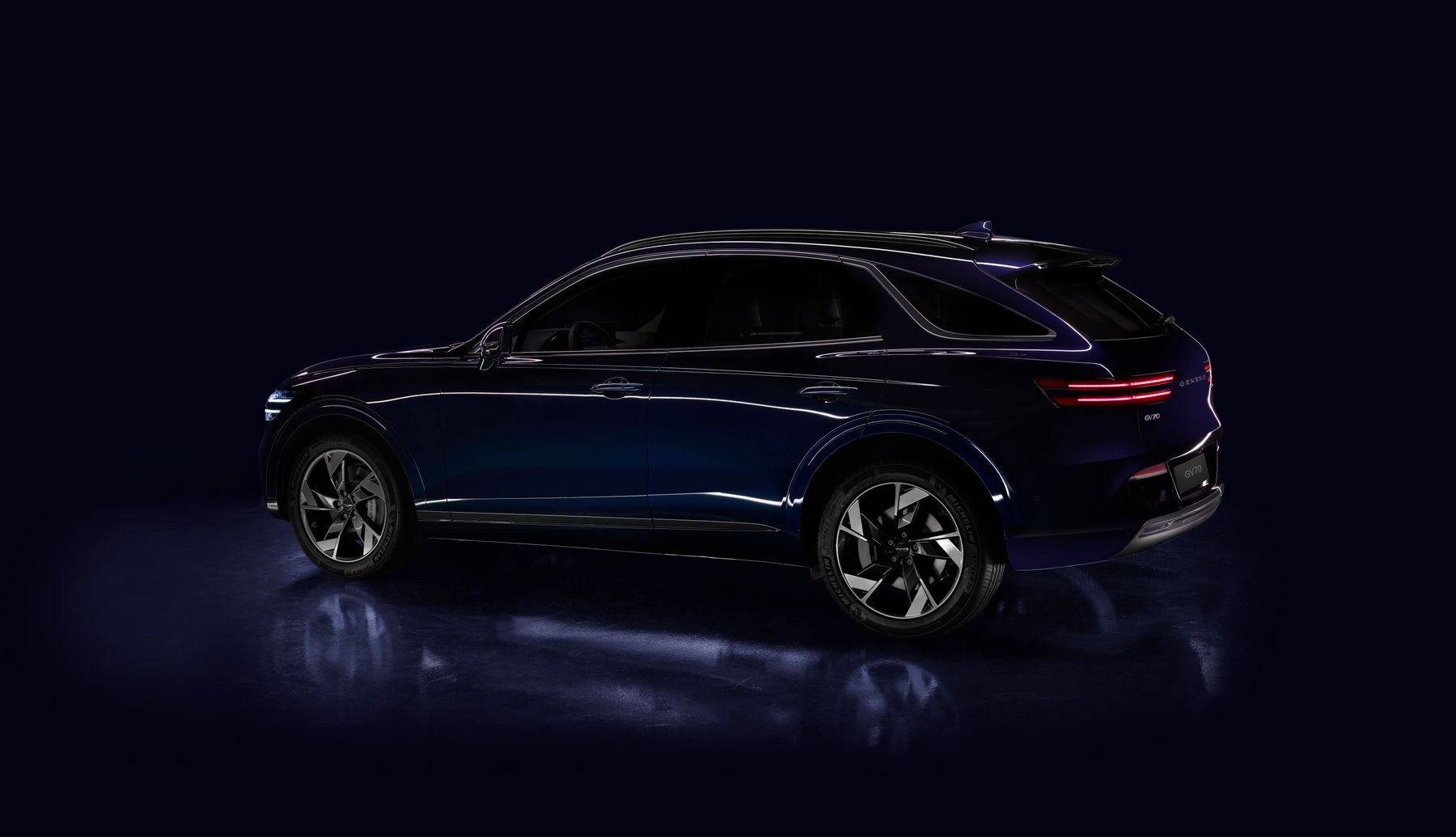 A new SUV in a dark studio